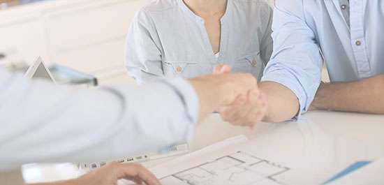 Action Gypsum Supply Services image showcasing people shaking hands as part of a credit services deal.