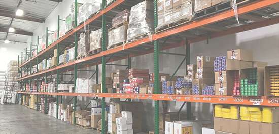 Action Gypsum Supply Services Tile Stocking image: Warehouse Shelves stocked with Action Gypsum Supply products